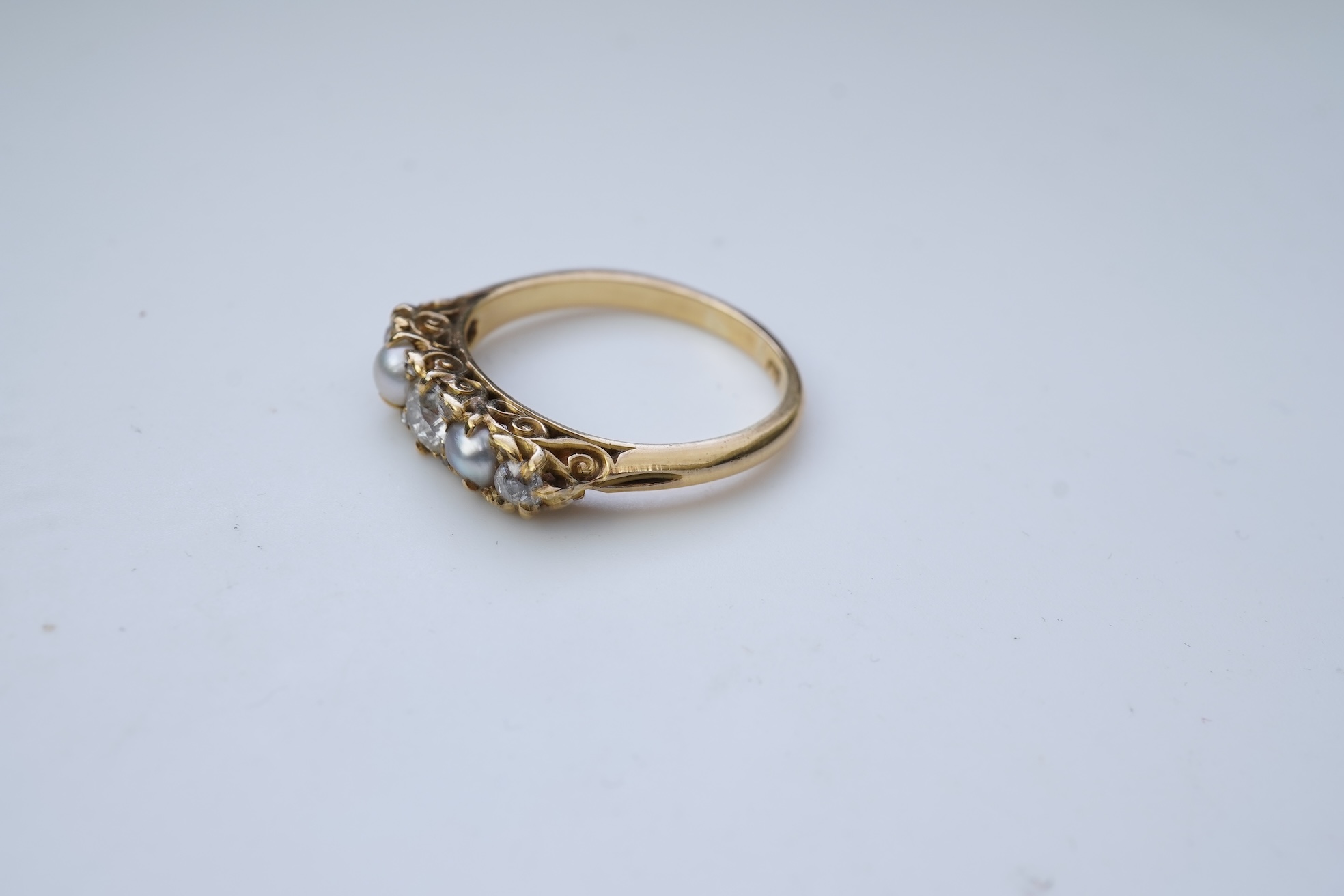 A five-stone pearl and diamond ring, early 20th century